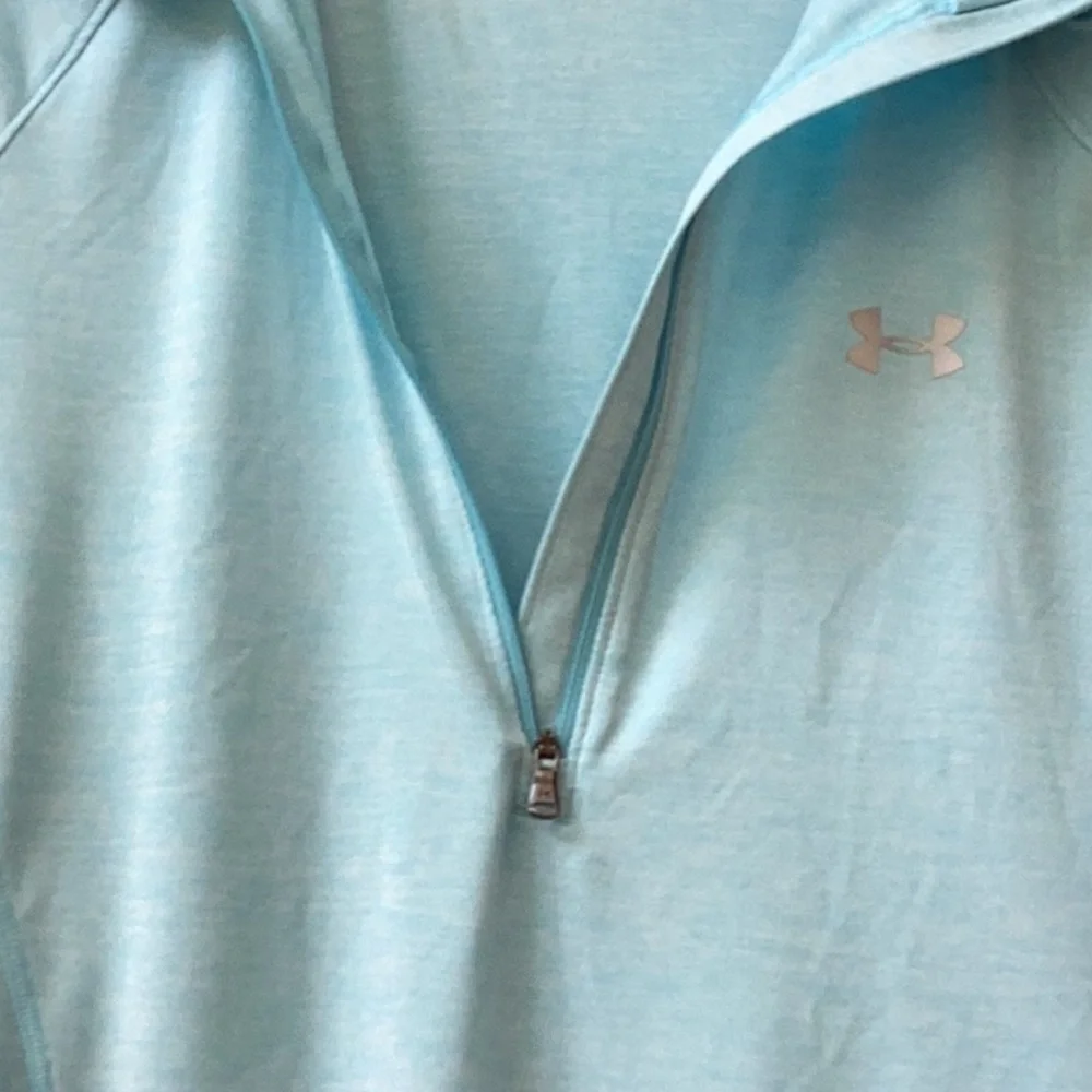 Under Armour light blue, lightweight, fitted quarter zip pullover. Women’s MED
